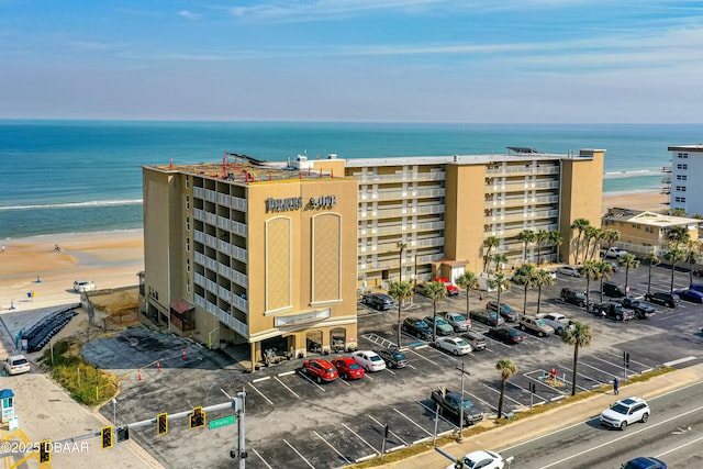 exterior space with a beach view and a water view