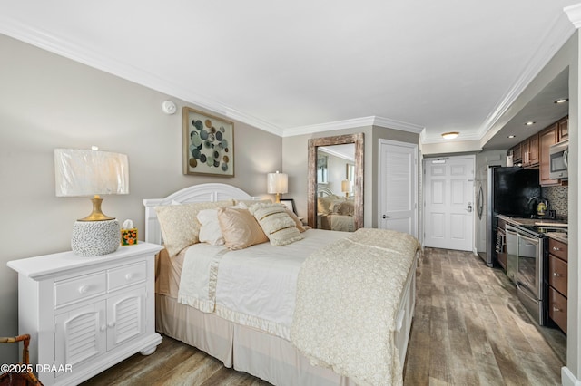 bedroom featuring ornamental molding and dark hardwood / wood-style floors