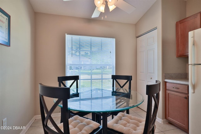 dining room with light tile patterned floors and ceiling fan