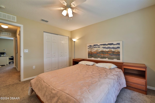 bedroom featuring ceiling fan, carpet flooring, and a closet