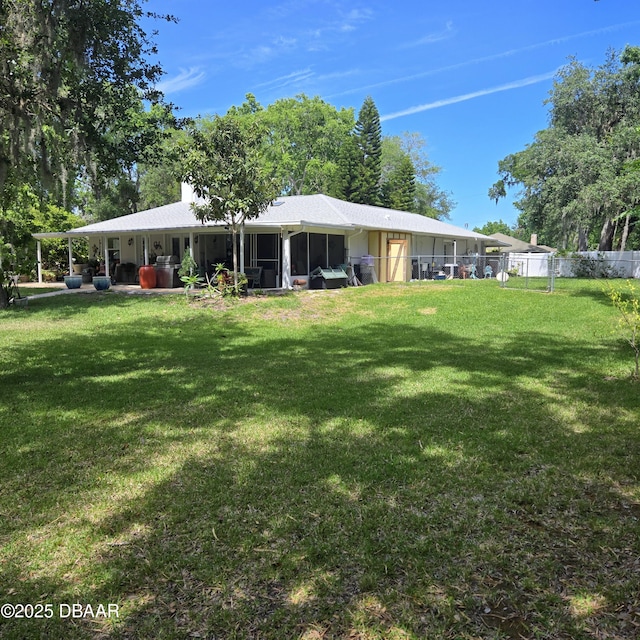 1010 Bolton Rd, New Smyrna Beach, FL 32168 - rear view of house with a yard and fence