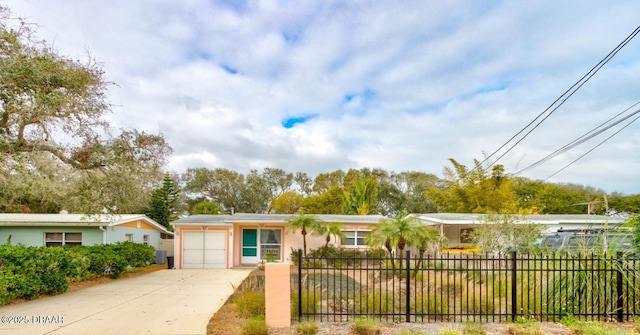 ranch-style home featuring a garage