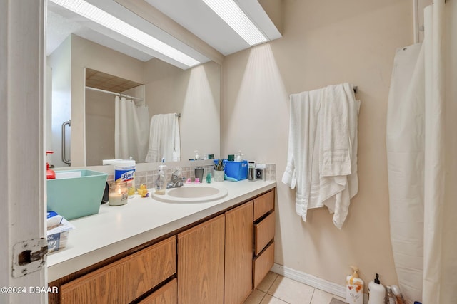 bathroom with tile patterned flooring and vanity