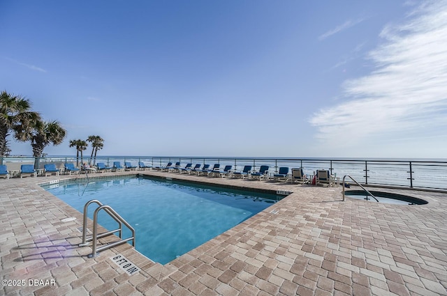 3311 S Atlantic Ave Unit 602, Daytona Beach Shores, FL 32118 - community pool featuring a patio area and a water view