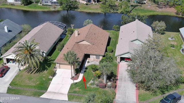 drone / aerial view with a residential view and a water view