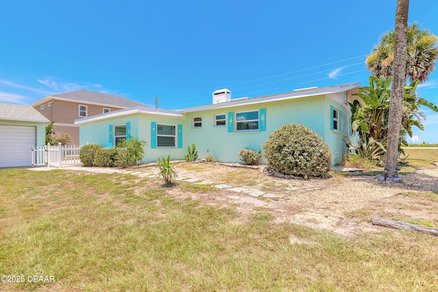 3622 Ocean Shore Blvd, Ormond Beach, FL 32176 - view of front of house featuring stucco siding, a chimney, and a garage