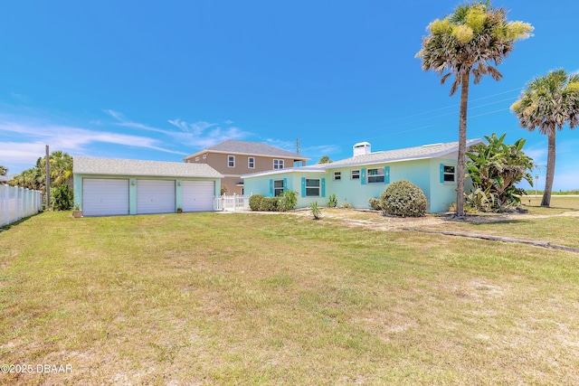 3622 Ocean Shore Blvd, Ormond Beach, FL 32176 - rear view of property with an outdoor structure, stucco siding, an attached garage, and driveway
