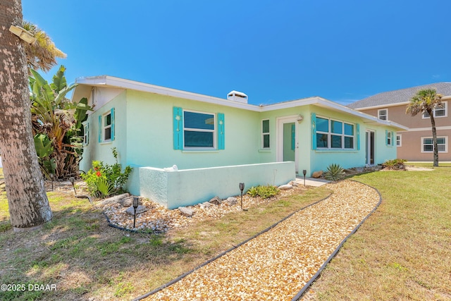 3622 Ocean Shore Blvd, Ormond Beach, FL 32176 - view of front facade featuring a front yard and stucco siding