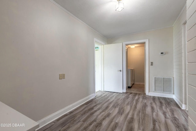 3622 Ocean Shore Blvd, Ormond Beach, FL 32176 - unfurnished room featuring wood finished floors and crown molding