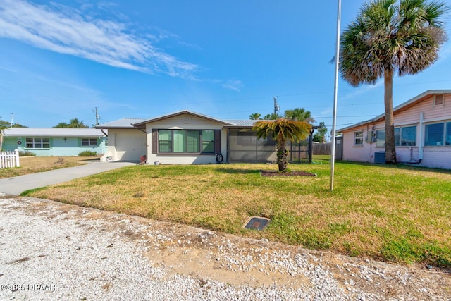37 Berkley Rd, Ormond Beach, FL 32176 - view of front facade featuring fence, an attached garage, driveway, and a front lawn