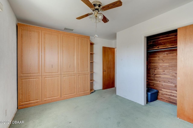 37 Berkley Rd, Ormond Beach, FL 32176 - unfurnished bedroom with light colored carpet, a closet, and a ceiling fan