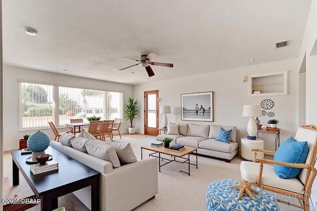 37 Berkley Rd, Ormond Beach, FL 32176 - living room featuring ceiling fan and light carpet