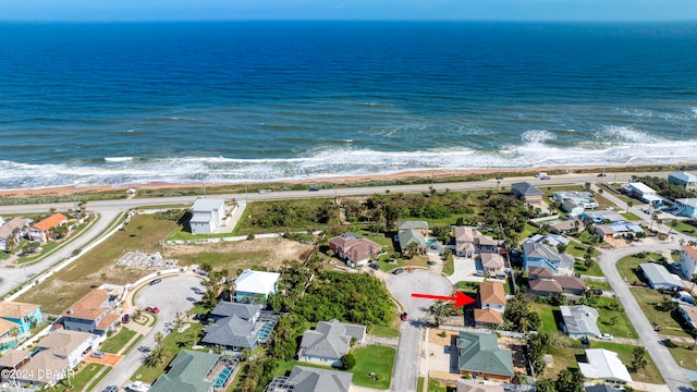 drone / aerial view with a view of the beach and a water view