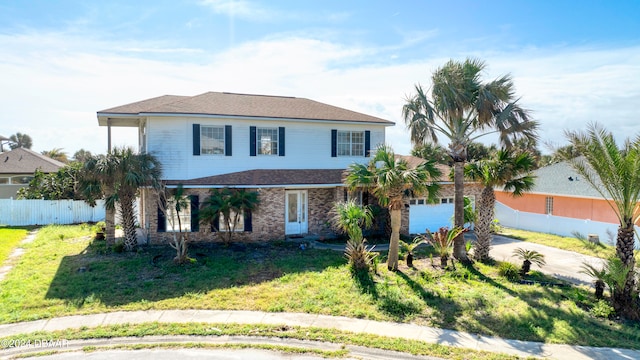 view of front facade featuring a garage and a front yard