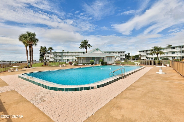 view of swimming pool featuring a patio