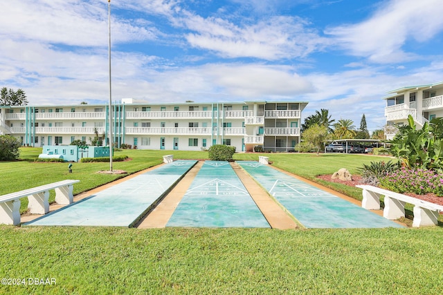 view of community with a lawn