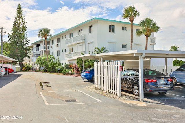 view of parking / parking lot with a carport