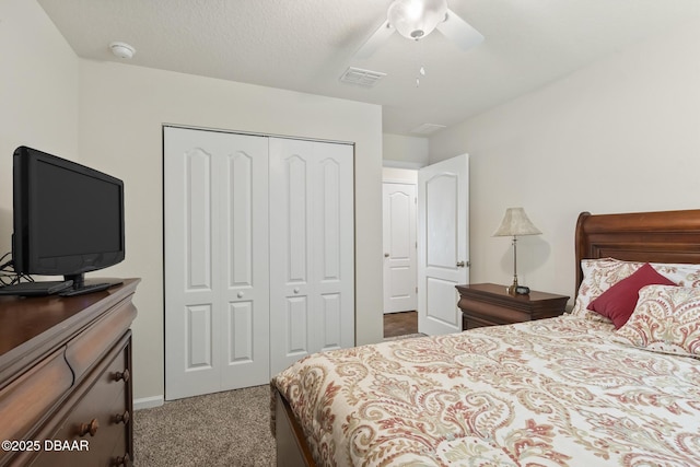 carpeted bedroom featuring a closet and ceiling fan