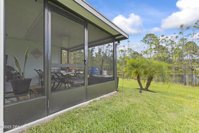 view of yard featuring a sunroom