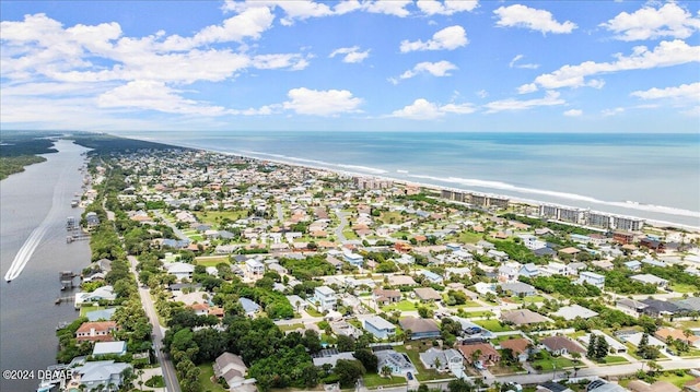 bird's eye view featuring a water view and a view of the beach