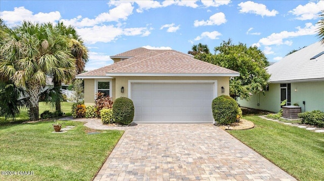 view of front of house with a front lawn and a garage