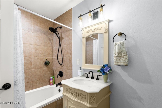 bathroom featuring shower / tub combo with curtain and vanity