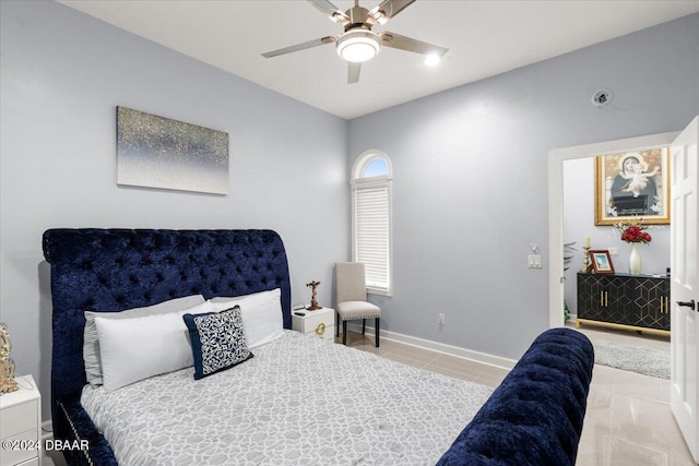 tiled bedroom with ceiling fan