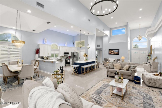 tiled living room featuring a wealth of natural light and a high ceiling