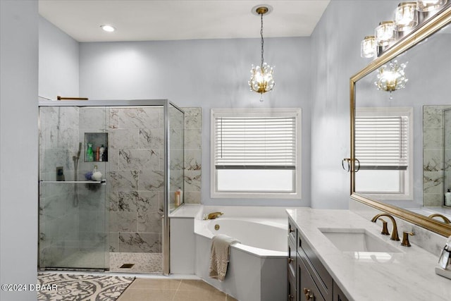 bathroom featuring shower with separate bathtub, vanity, tile patterned floors, and plenty of natural light