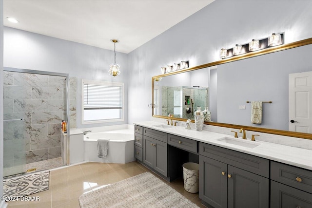 bathroom featuring vanity, independent shower and bath, tile patterned floors, and an inviting chandelier