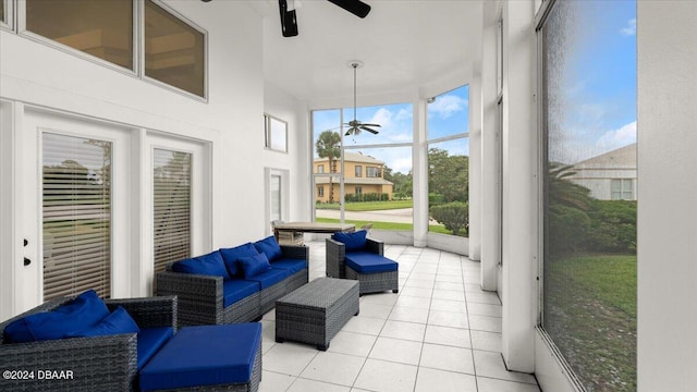 sunroom / solarium featuring ceiling fan