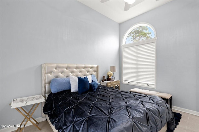 bedroom featuring ceiling fan and lofted ceiling