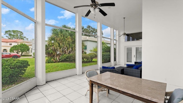 sunroom / solarium featuring ceiling fan