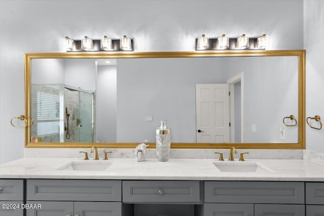 bathroom with walk in shower and vanity