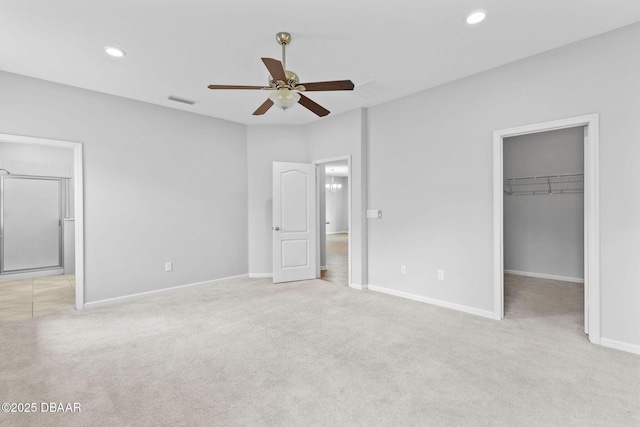 115 Pergola Pl, Ormond Beach, FL 32174 - unfurnished bedroom with a spacious closet, carpet, recessed lighting, a closet, and ensuite bathroom