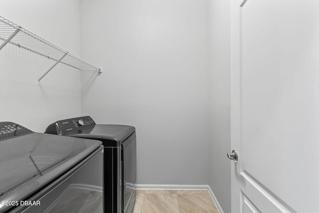 115 Pergola Pl, Ormond Beach, FL 32174 - laundry area with washing machine and clothes dryer and baseboards