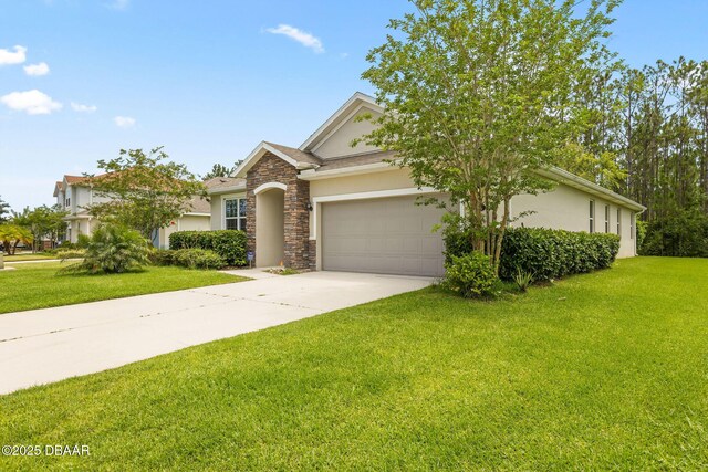 115 Pergola Pl, Ormond Beach, FL 32174 - view of front of house featuring stucco siding, an attached garage, concrete driveway, and a front lawn