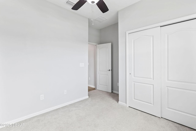 115 Pergola Pl, Ormond Beach, FL 32174 - unfurnished bedroom featuring light carpet, a closet, and a ceiling fan