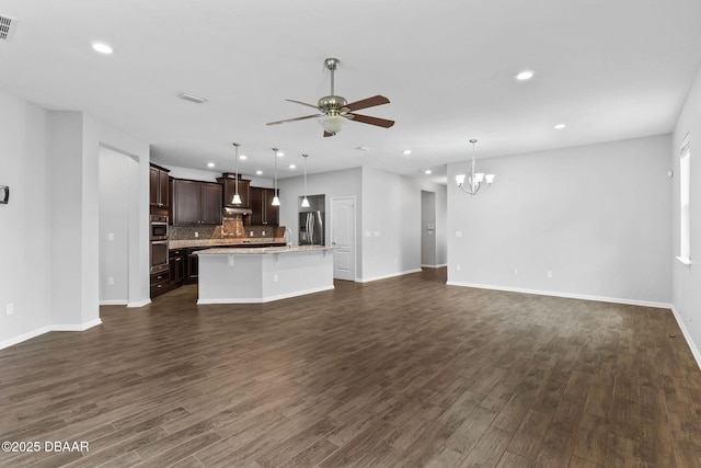 115 Pergola Pl, Ormond Beach, FL 32174 - unfurnished living room with recessed lighting, ceiling fan, a chandelier, and dark wood-type flooring