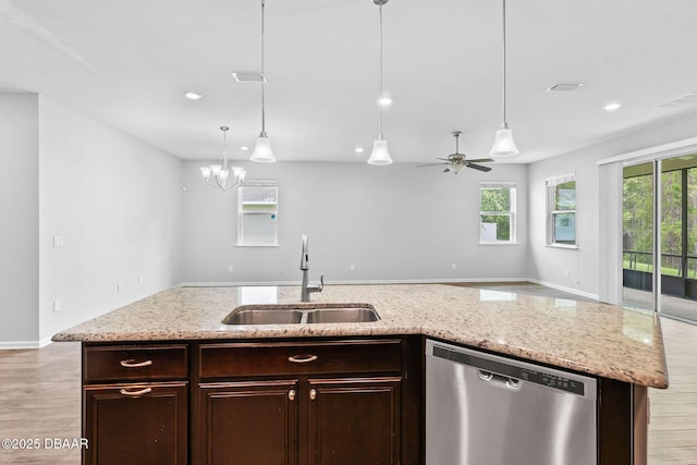 115 Pergola Pl, Ormond Beach, FL 32174 - kitchen with stainless steel dishwasher, open floor plan, light wood finished floors, pendant lighting, and recessed lighting