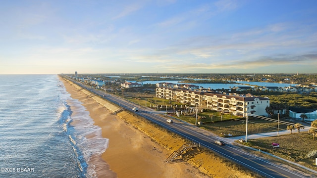 drone / aerial view featuring a view of the beach and a water view