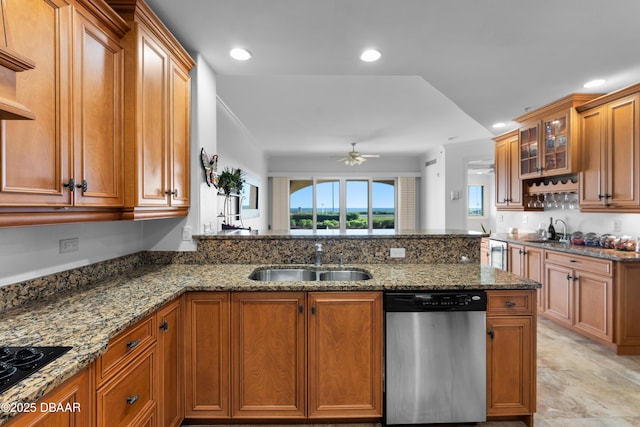 kitchen with a sink, black cooktop, stainless steel dishwasher, and a ceiling fan