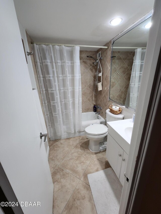 2800 N Atlantic Ave Unit 1006, Daytona Beach, FL 32118 - full bath featuring shower / tub combo with curtain, vanity, and tile patterned floors