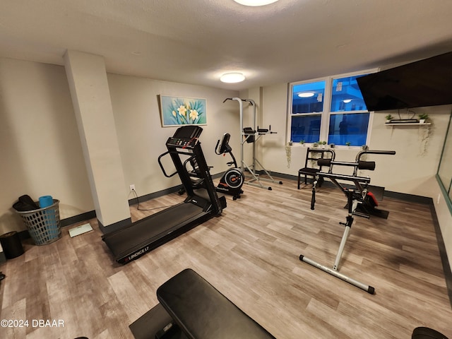 2800 N Atlantic Ave Unit 1006, Daytona Beach, FL 32118 - workout area with wood finished floors and baseboards