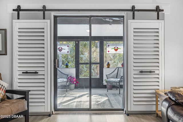 doorway with light wood-type flooring