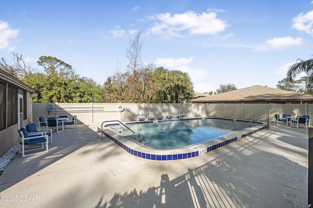 view of swimming pool with a patio area