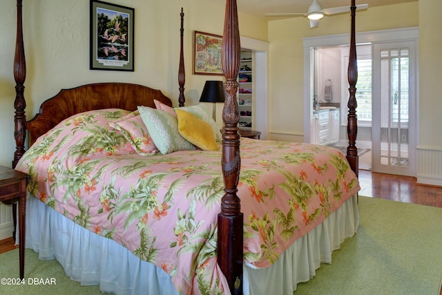 bedroom with ceiling fan, wood-type flooring, and a closet