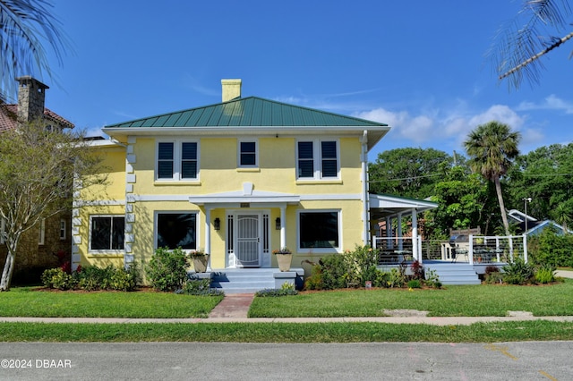 view of front facade featuring a front yard