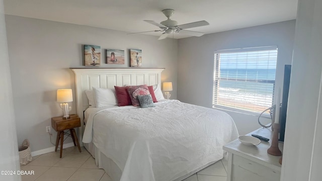 bedroom with ceiling fan and light tile patterned floors