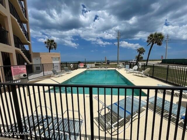 view of swimming pool featuring a patio